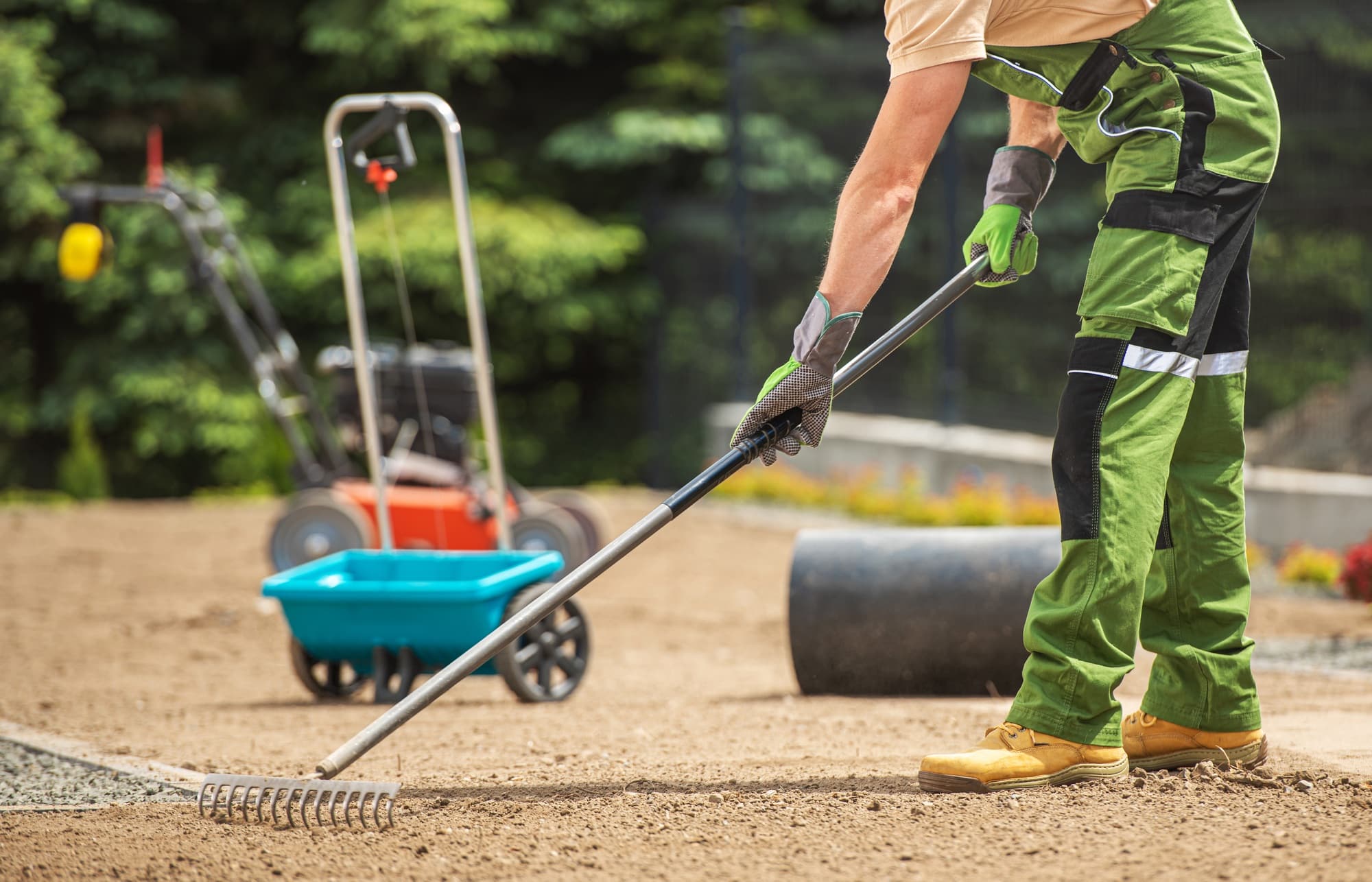 Landscaper Preparing Backyard Soil for a Grass Seeding